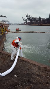 National Industrial Maintenance team member working on an emergency cleanup